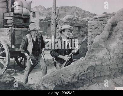 Original Film Title: RIO BRAVO.  English Title: RIO BRAVO.  Film Director: HOWARD HAWKS.  Year: 1959.  Stars: WALTER BRENNAN; JOHN WAYNE. Credit: WARNER BROTHERS / Album Stock Photo