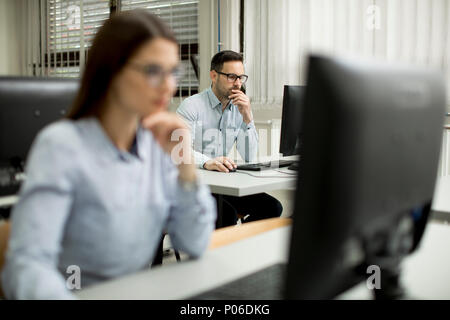 Young couple learning in the classroom Stock Photo