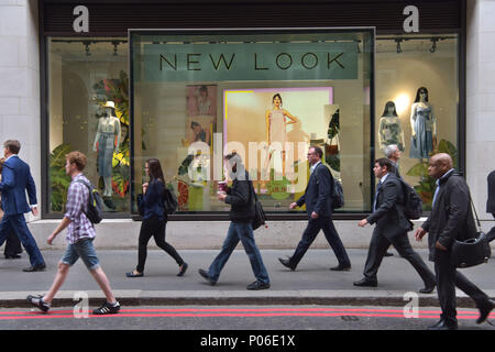 Office workers, tourists and pedestrians walk past branches of New Look on the junction of Gracechurch and Lombard Street in the City of London. The h Stock Photo