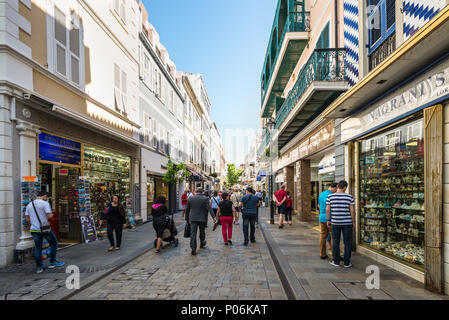 Gibraltar, UK - May 18, 2017: Shoppers walking down Main Street in Gibraltar, this is a popular tourist area in the city. Stock Photo