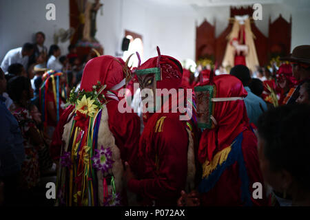 Atanquez, Cesar, Colombia. 31st May, 2018. At the foothill of the snow-covered peaks of Sierra Nevada, within the Kankuamo Indians territory, a colorful celebration of the Christian feast of Corpus Christi is held every year. It us a Christian religious event that normally coincides with the summer solstice. Pagan Demon characters, Indian sacred places and other Pre-Columbian features are incorporated. The ritual represents an allegorical fight between the God and the Devil.'The Dance of the Devils'' is an ancient tradition kept for centuries in few communities on the Colombia's Caribbean c Stock Photo