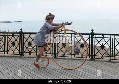 Hastings, East Sussex, UK. 9th Jun, 2018. Francesca 'Daisy' Hill rides her penny farthing on the Hastings pier as she prepares for an event in London later today. The event organised by the penny farthing club hold training days and events throughout the year in London. © Paul Lawrenson 2018, Photo Credit: Paul Lawrenson / Alamy Live News Stock Photo