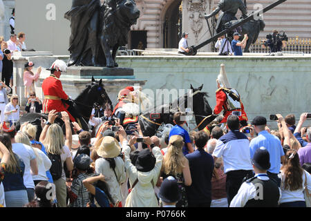 The Mall, London, UK, 9th June 2018. Retired armed forces field marshall and former Chief of Defense staff Lord Guthrie visibly struggles for some time, then eventually collapses and falls off his horse in what may have been a fainting attack during the hot sunshine at Trooping the Colour today. The incident happened in front of Buckingham Palace, the officer was riding in close proximity behind her Majesty the Queen's carriage. Credit: Imageplotter News and Sports/Alamy Live News Stock Photo