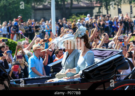 The Mall, London, UK, 9th June 2018. Catherine, Duchess of Cambridge and Camilla, Duchess of Cornwall in their carriage. The Sovereign's birthday is officially celebrated by the ceremony of Trooping the Colour, the Queen's Birthday Parade. Troops from the  Household Division, overall 1400 officers and soldiers are on parade, together with two hundred horses; over four hundred musicians from ten bands and corps of drums. The parade route extends from Buckingham Palace along The Mall to Horse Guards Parade, Whitehall and back again.Credit: Imageplotter News and Sports/Alamy Live News Stock Photo