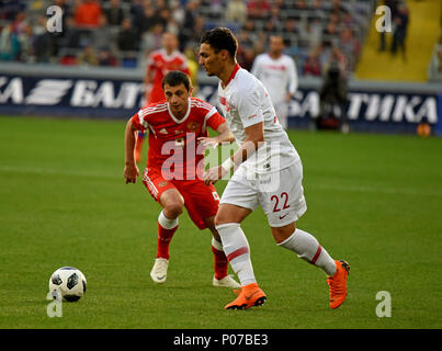 Moscow, Russia - June 5, 2018. Russian midfielder Alan Dzagoev against Turkish centreback Kaan Ayhan during international friendly against Russia at V Stock Photo