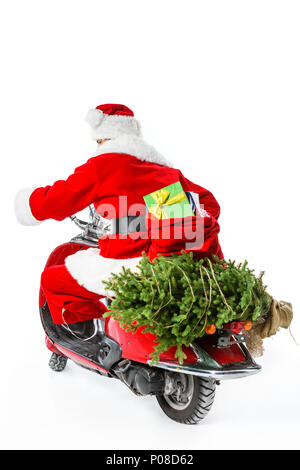 Santa Claus riding red scooter with christmas tree and big bag full of gifts, isolated on white Stock Photo
