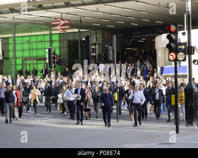 crowds of coummuters outside London Cannon Street Railway station during morning rush hour Stock Photo