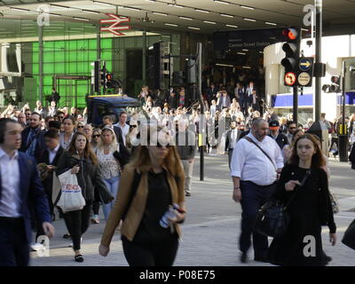 crowds of coummuters outside London Cannon Street Railway station during morning rush hour Stock Photo