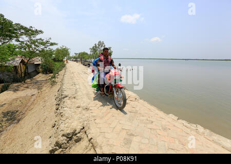 Motorbike is the only public transport of Gabura, a small island beside the Sundarbans. Satkhira, Bangladesh. Stock Photo