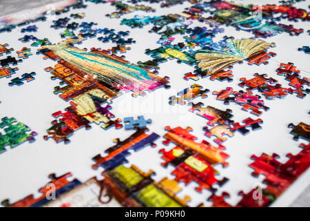 Large 1000 piece jigsaw puzzle pieces, multi colour, colourful educational family fun Stock Photo