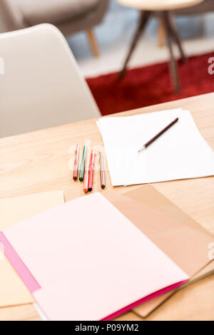 documents and folders with markers on table in office Stock Photo
