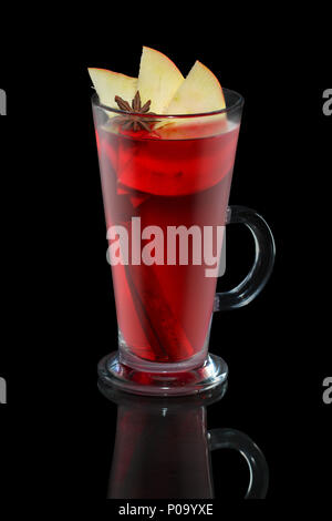Cup of apple and cherry tea with cinnamon stick isolated on balck Stock Photo