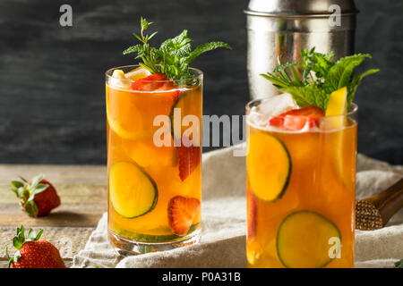 Sweet Refreshing Pimms Cup Cocktail with Fruit and Mint Stock Photo