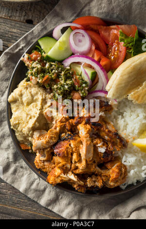 Homemade Doner Kebab Plate with Hummus Rice and Pita Stock Photo
