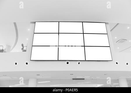 Video wall LED screen array billboard setup installation indoor office hall Stock Photo