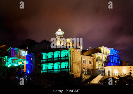 Narikala fortress and Public Sulfuric bath with colorful lighting at night in central Tbilisi, Georgia Stock Photo