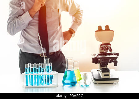 scientist thinking to research and development in chemical lab in find new formula concept Stock Photo