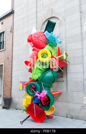 Bright colourful sculpture constructed from plastic toys, wheelbarrow, kayak as an example of street art in Quebec City, Quebec, Canada Stock Photo