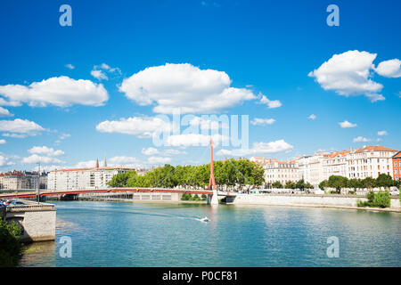 Cityscape of Lyon with Passerelle du Palais de Justice footbridge over Saone river at sunny day Stock Photo