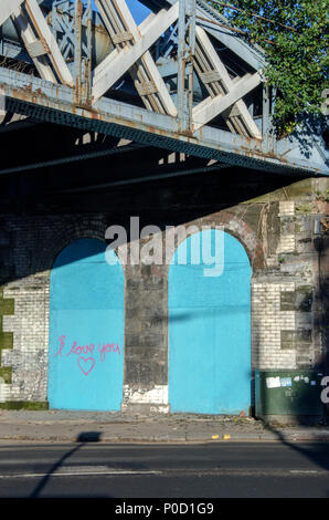 GLASGOW, SCOTLAND - NOVEMBER 22nd 2013: Old blue Glasgow railway arches on Cumberland Street, Gorbals. Stock Photo