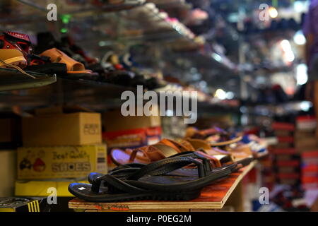 Family Shopping for Shoes for celebration of Hari Raya Aidilfitri (Eid al-Fitr) at a street Market in Penayong, Banda Aceh, Indonesia Stock Photo