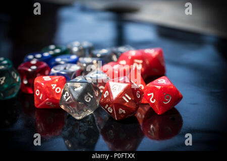 A set of colorful RPG dice on a black table Stock Photo