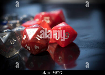 A set of colorful RPG dice on a black table Stock Photo