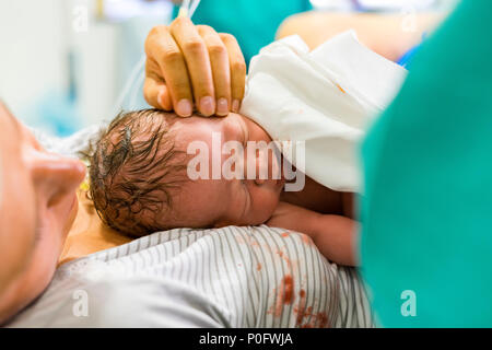 Mother and her newborn boy just after delivery Stock Photo