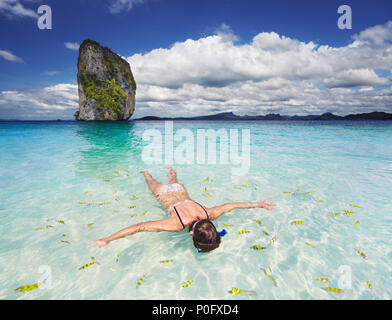 Woman swimming with snorkel, Andaman Sea, Thailand Stock Photo