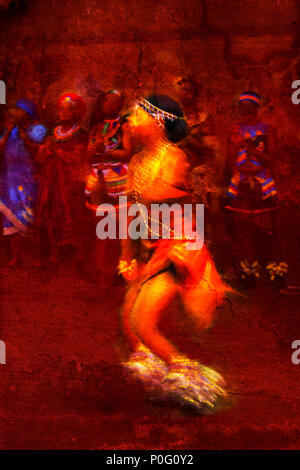 Brilliantly colored female African dancer against a red textured background Stock Photo