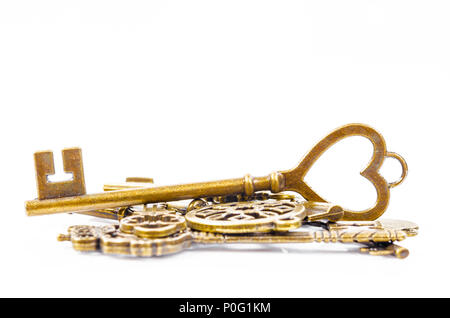 Heap of keys vintage isolated on white background. Stock Photo