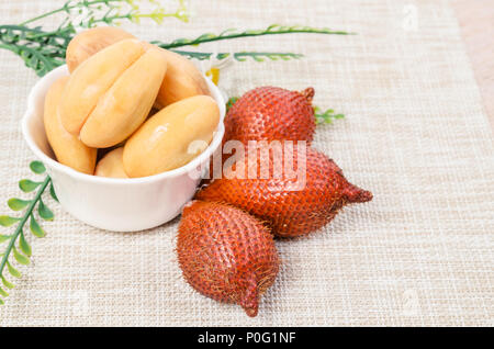 Salak Palm , waive or snake fruit on tablecloth. Stock Photo