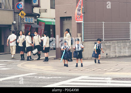 KYOTO,JAPAN, April 22, 2017: Japanese young students are coming back from elementary school in Kyoto, Japan. Stock Photo
