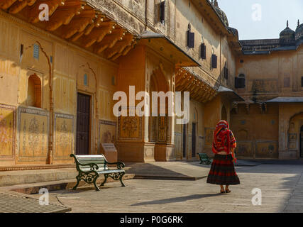 A young woman (travaler) walking at the ancient fort in Jaipur, India. Stock Photo