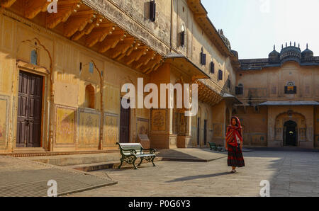 A young woman (travaler) walking at the ancient fort in Jaipur, India. Stock Photo