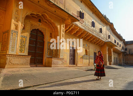 A young woman (travaler) walking at the ancient fort in Jaipur, India. Stock Photo