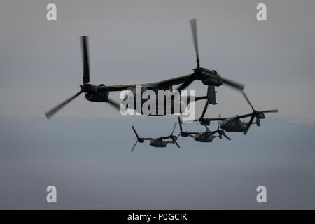 Four CV-22 Osprey tiltrotor aircraft assigned to the 353rd Special Operations Group Detachment 1 fly above Tokyo, Japan, April 5, 2018. Approximately 100 Air Commandos and five Ospreys deployed to Yokota Air Base to participate in regional exercises. (U.S. Air Force photo by Senior Airman Joseph Pick) Stock Photo