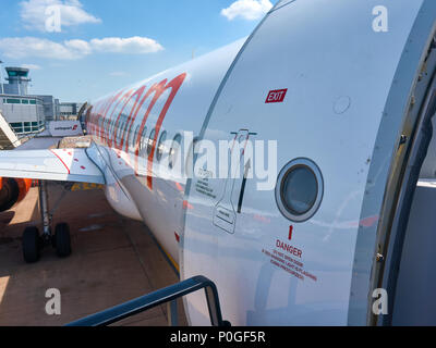 Doors and the side of an easyjet Airbus A320 aircraft as seen while boarding; Bristol airport. Stock Photo