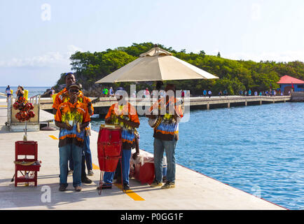 LABADEE, HAITI - MAY 01, 2018: local music group singing and greeting tourists from cruise ship docked in Labadee, Haiti on May 1 2018. Stock Photo