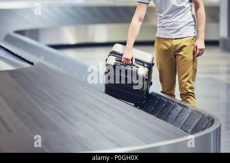 Baggage claim in airport terminal. Suitcases on the airport luggage conveyor belt. 3d ...
