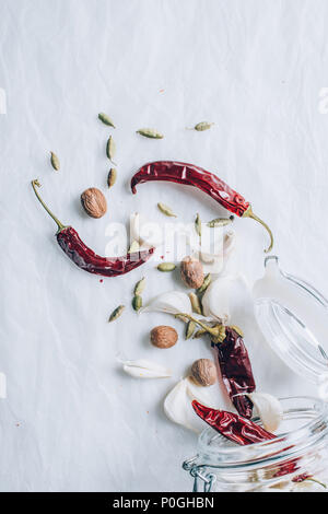 top view of jar and different spices on white table Stock Photo