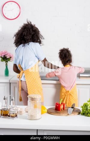 selective focus of african american family cooking on kitchen Stock Photo