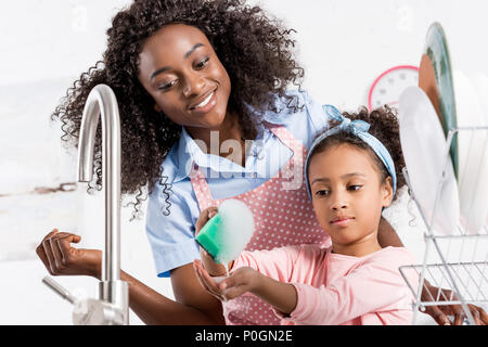 Dishwashing Happy Young Woman Washing Dishes Stock Photo, Picture and  Royalty Free Image. Image 14193419.