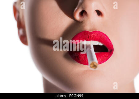 cropped image of woman with makeup smoking cigarette isolated on white  Stock Photo