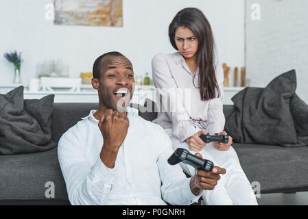 African American Boyfriend Winning Video Game Girlfriend Stock Photo by  ©EdZbarzhyvetsky 181571646