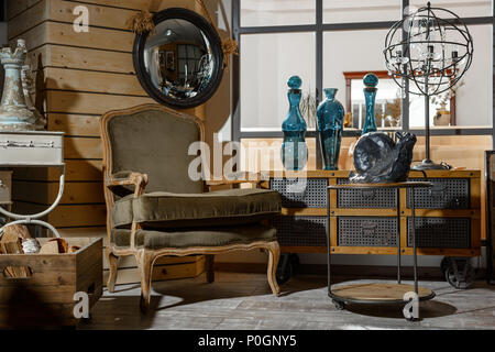 interior of modern retro styled living room with armchair, table and decoration Stock Photo