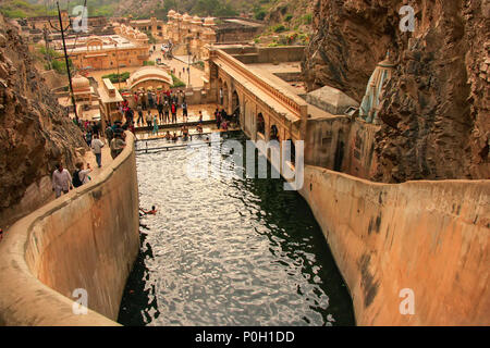 Galtaji Temple near Jaipur, Rajasthan, India. It consists of a series of temples built in to a narrow crevice in the ring of hills that surround Jaipu Stock Photo