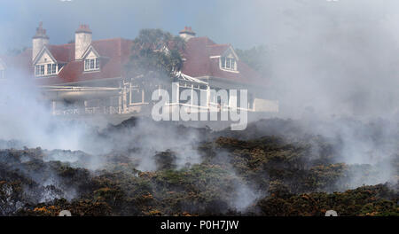 Firefighters battle a gorse fire at Howth Head in Dublin as the hot ...