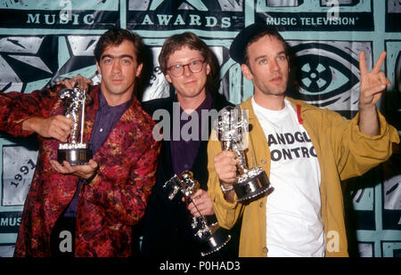 UNIVERSAL CITY, CA - SEPTEMBER 05: (L-R) Musicians/singers Bill Berry, Mike Mills and Michael Stipe of R.E.M. group attend the Eighth Annual MTV Video Music Awards on September 5, 1991 at Universal Amphitheatre in Universal City, California. Photo by Barry King/Alamy Stock Photo Stock Photo