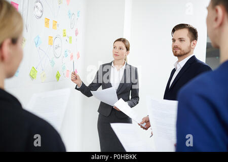 Business people having a presentation at office. Woman speaking at the seminar Stock Photo